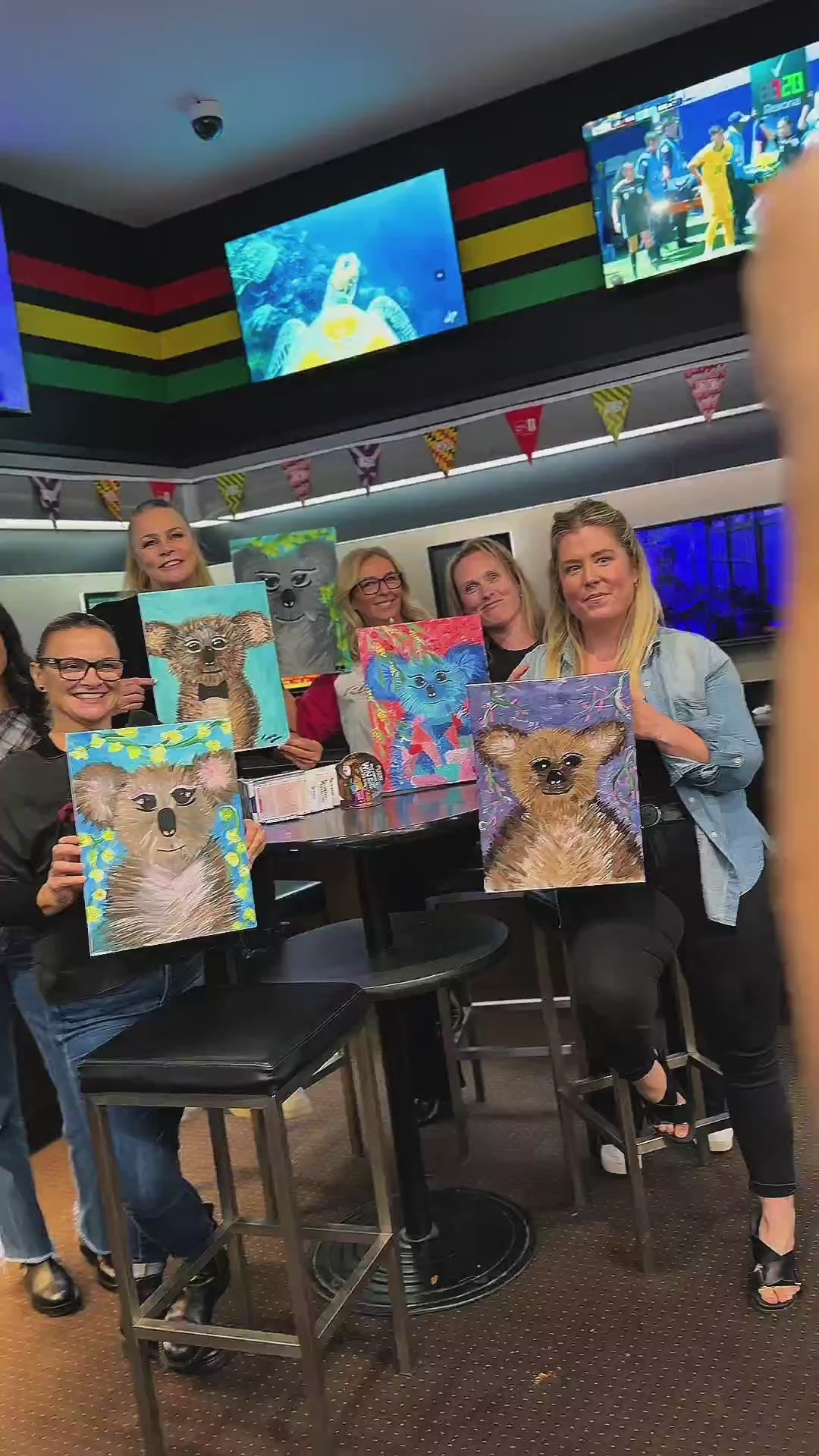 Sold out crowd at the Penrith Aussie Rock Paint and Sip holding their koala paintings