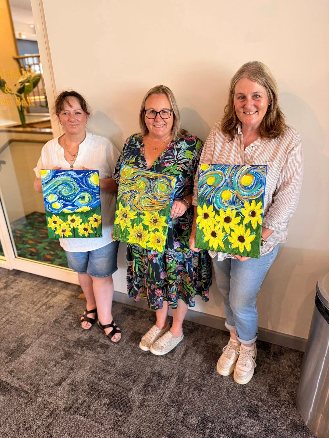 Wyong Paint and Sip customers with their sunflower artworks