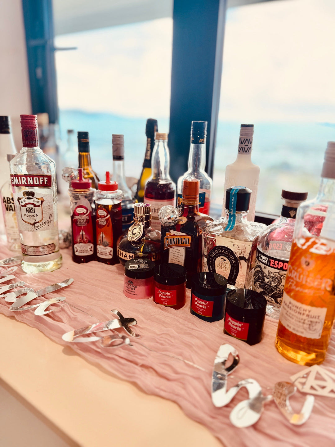 Drinks sitting on window sill overlooking Airlie Beach