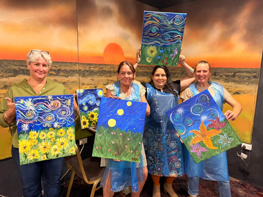 Humpty Doo Paint and Sip customers smiling with their finished artworks