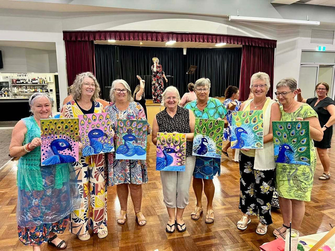 South West Rocks Paint and Sip customers with artworks and Lotti Rem in the background on stage singing