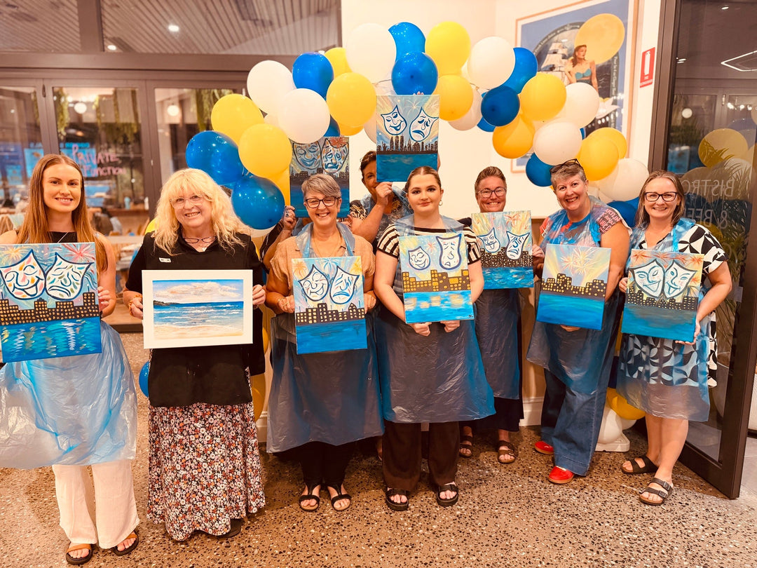 Townsville Paint and Sip attendees smilings while showing their completed artworks at Paint Juicy