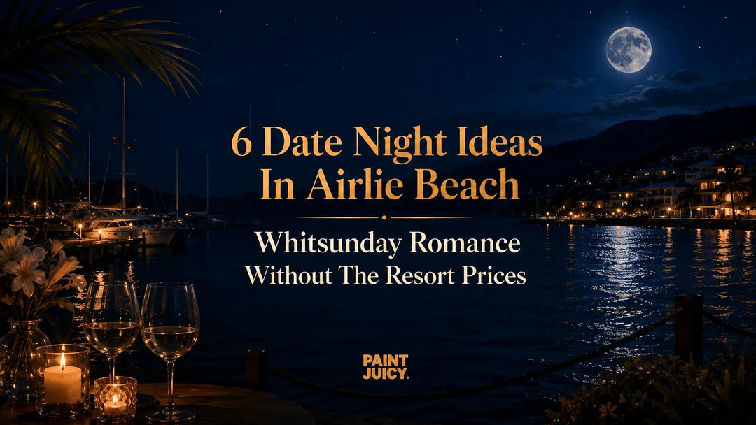 Paint Juicy date night ideas in Airlie Beach, Whitsunday marina at night with moonlit water and two wine glasses