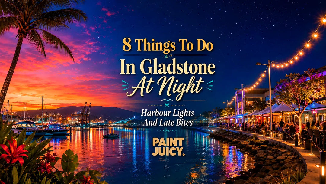 Paint Juicy things to do in Gladstone at night, the harbour marina and waterfront dining strip glowing after sunset