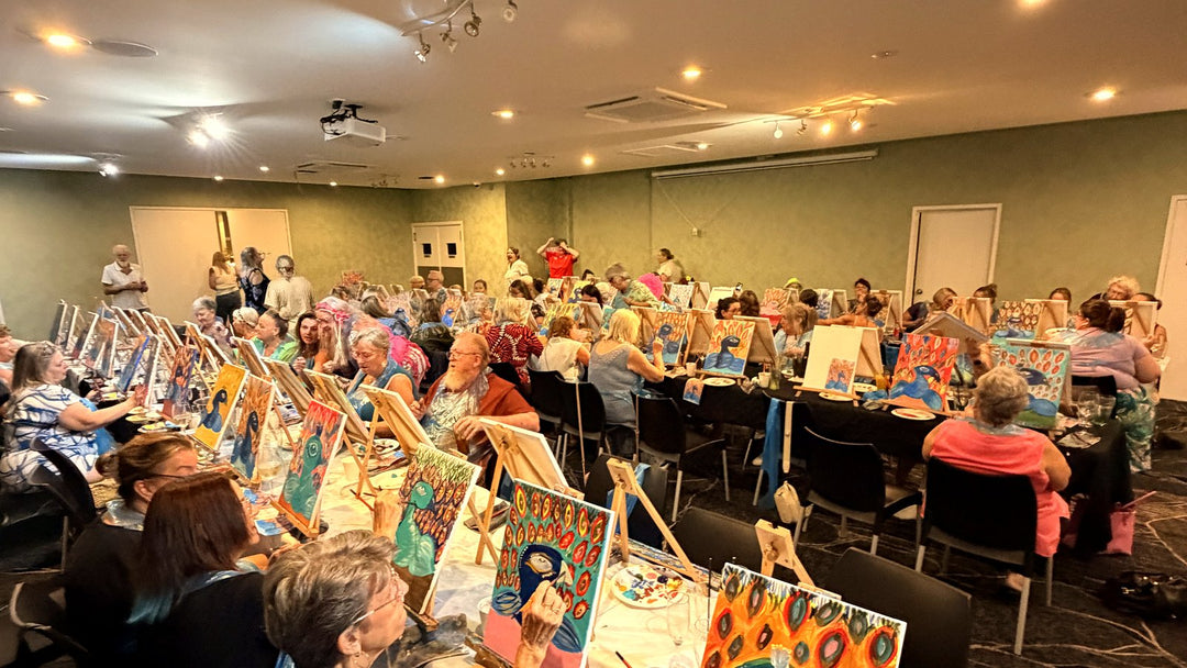 Packed function room at a Penrith 80s and 90s Paint and Sip event in May 2026 with rows of easels and peacock paintings on every table