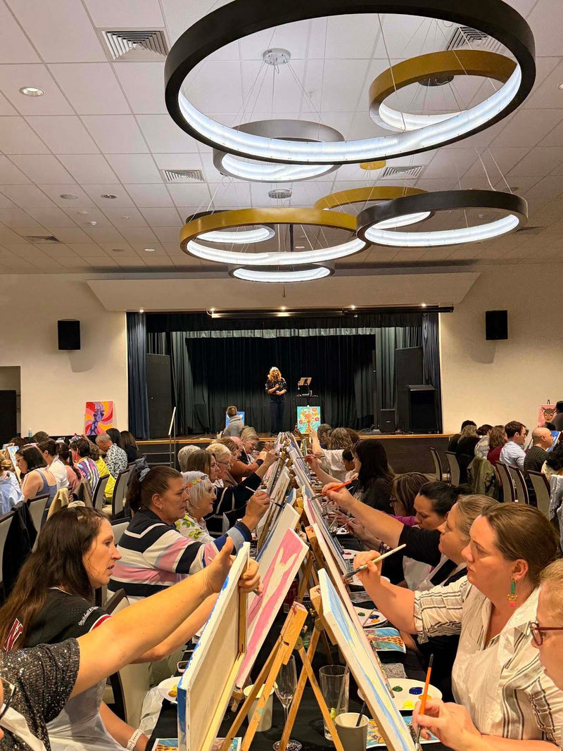 large group of people at paint and sip Paint Juicy
