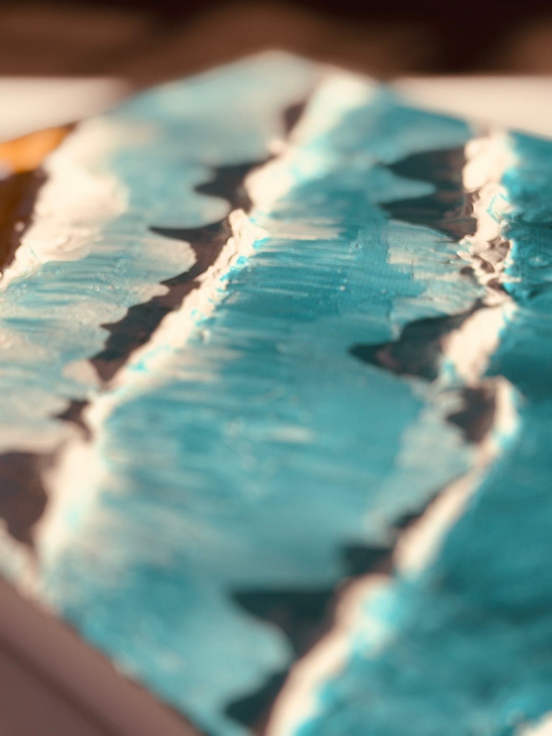 Detail of thick turquoise and white texture paste ridges on a Paint Juicy textured art canvas