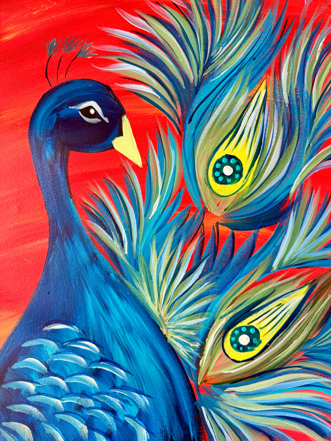 Peacock painting on canvas, a cobalt blue peacock against a red sky with green and gold tail feathers, the artwork you paint at this Port Macquarie ABBA paint and sip