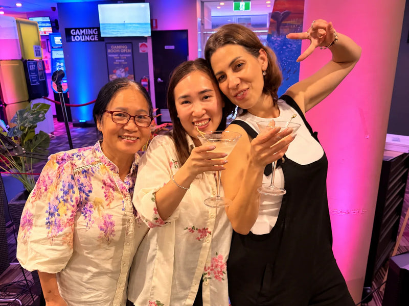Three friends sharing cocktails at a girls night paint and sip at Parap Tavern in Darwin