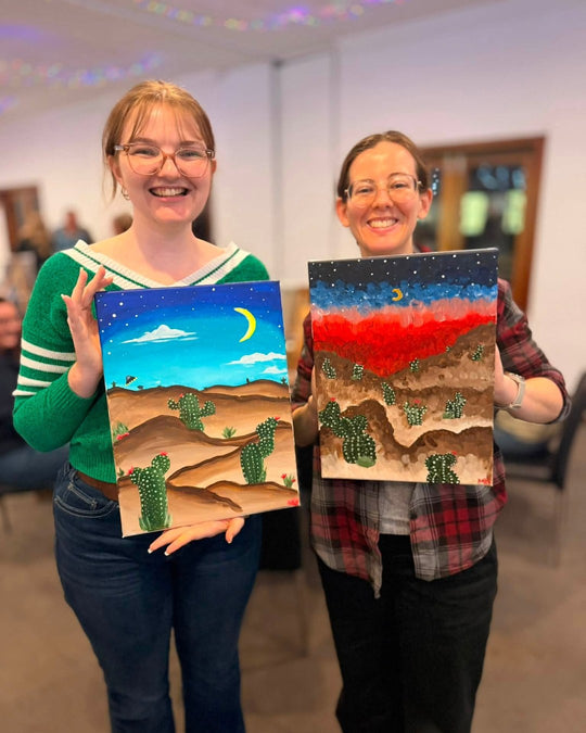 Paint Juicy guests holding their finished Prick My Interest cactus paintings at a paint and sip night, photo 6 of 6