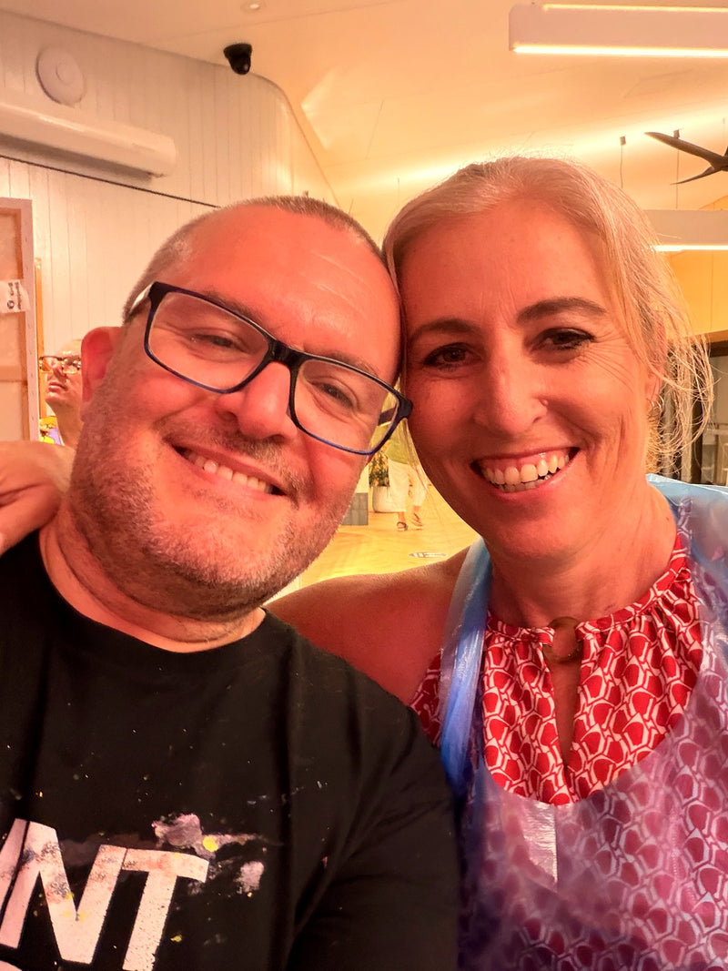 two people smiling into camera